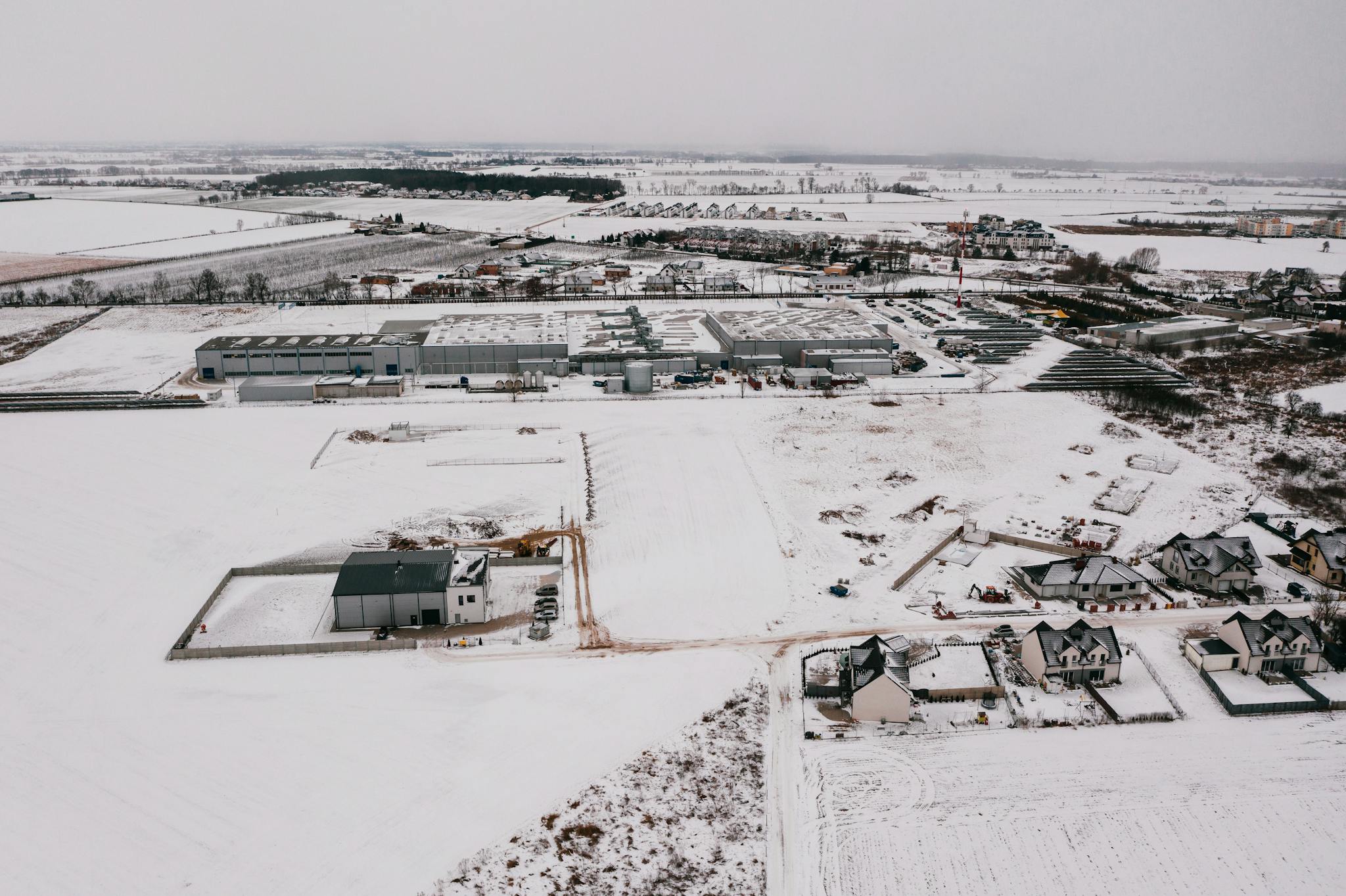White and Black House on Snow Covered Ground